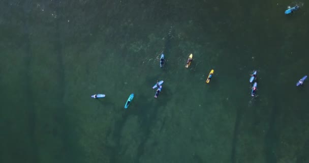 Aerial view of surfers at Balangan beach — Stock Video
