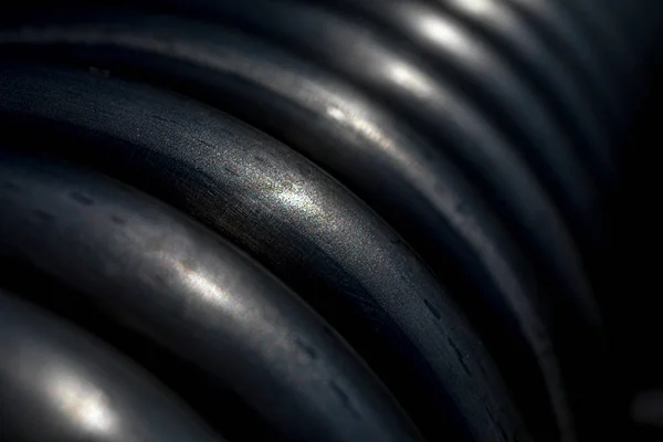 Abstract dark black and white coil background.