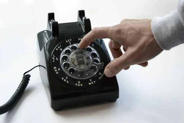 A Hand Dials an Old Rotary Phone — Stock Fotó
