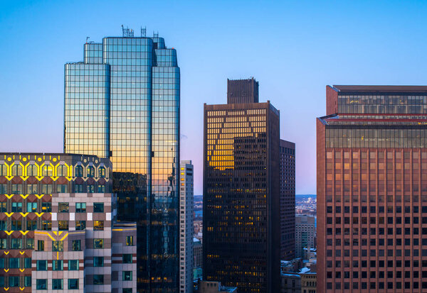 Boston Massachusetts, December 19th, 2019: One Boston Place and other big office buildings in downtown at sunrise.