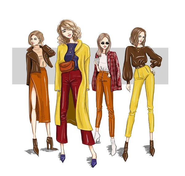 Four bright girls models in trendy outfits — Stockvector