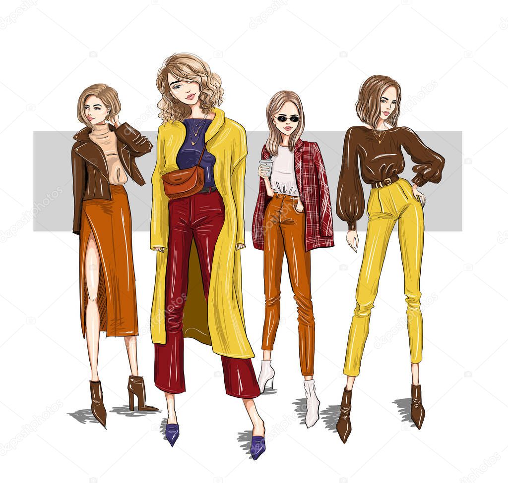 four bright girls models in trendy outfits