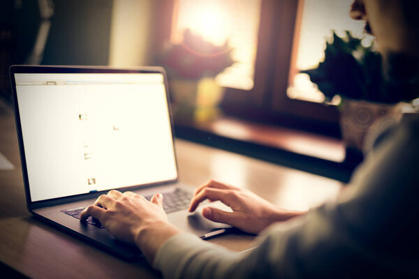 Man's hands typing on laptop 