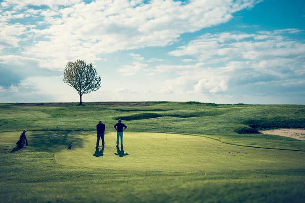 People play golf