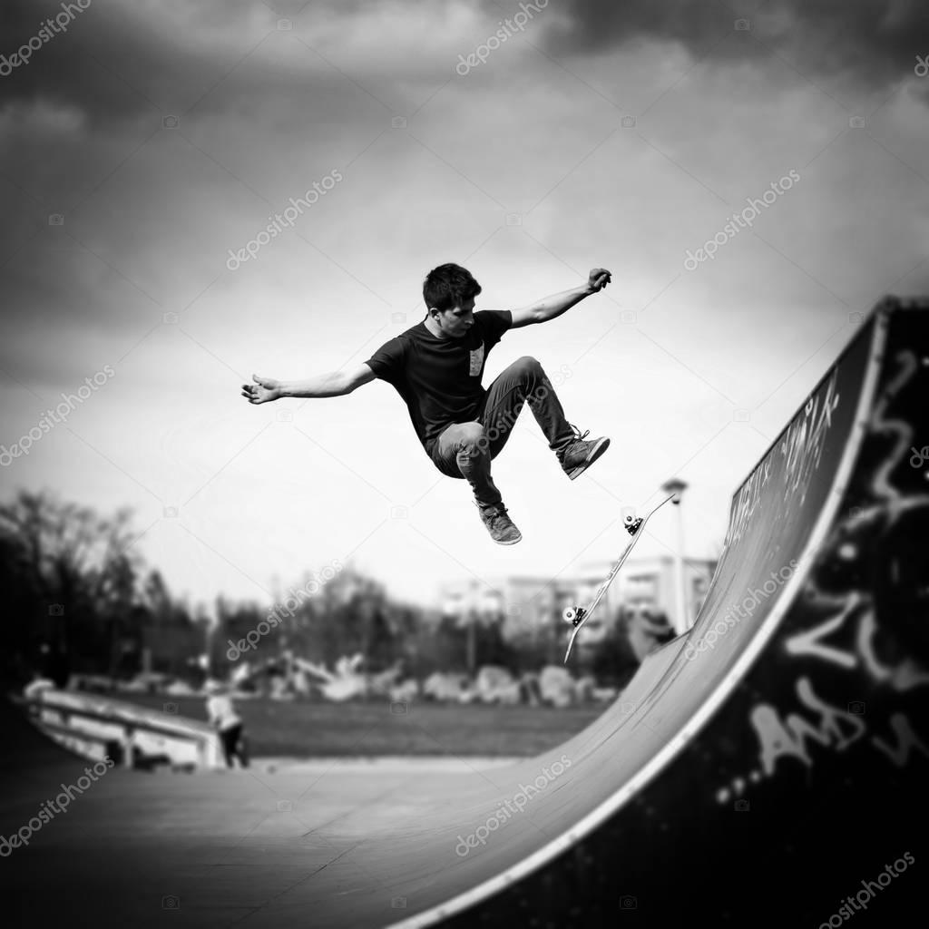 Skater doing kickflip on the ramp