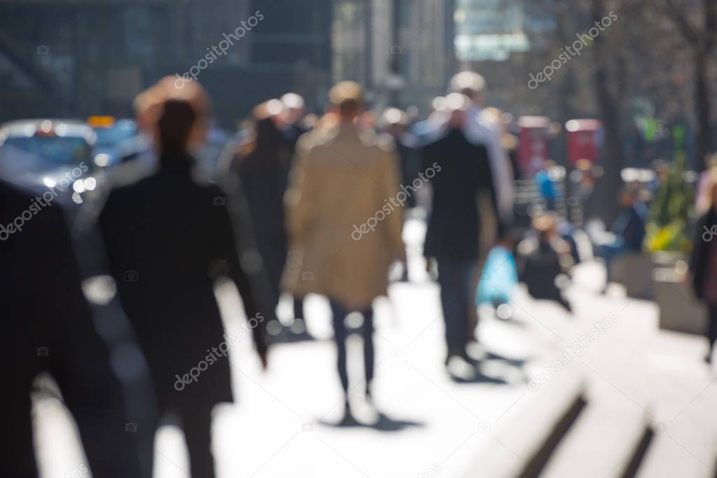 Blurred image of walking business people in the City of London. UK