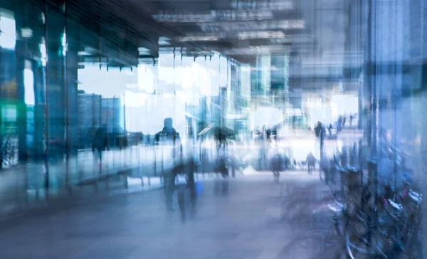 Modern architecture of Canary Wharf with people walking blur.  Multiple exposure image — Stock Photo, Image