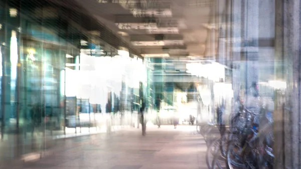 Modern architecture of Canary Wharf with people walking blur.  Multiple exposure image — Stock Photo, Image