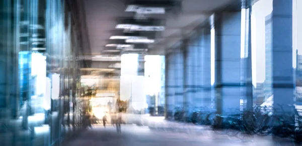 Modern architecture of Canary Wharf with people walking blur.  Multiple exposure image — Stock Photo, Image