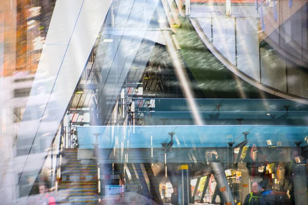 Modern architecture, Train station with escalators, supportive metal beams, tickets machine. Multiple exposure image — Stock Photo, Image