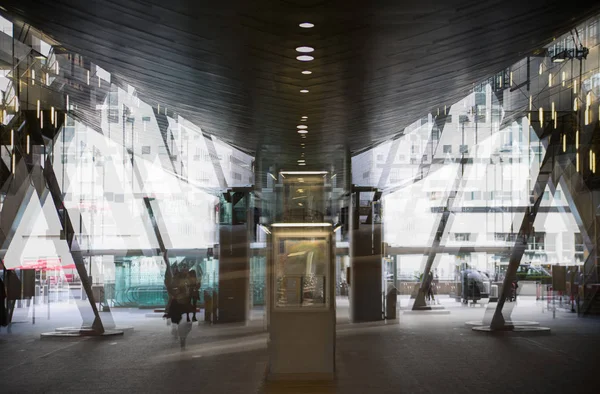 Modern architecture, Train station with escalators, supportive metal beams, tickets machine. Multiple exposure image — Stock Photo, Image