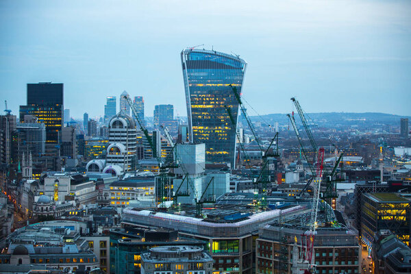 London, UK - December 19, 2015: City of London at sunset. Famous skyscrapers City of London business and banking aria view at dusk.