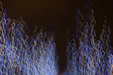 Arka plan Christmas lights uzun pozlama ile yapılmış. Görüntü arka plan veya fotoğraf manipülasyon için