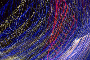 Arka plan Christmas lights uzun pozlama ile yapılmış. Görüntü arka plan veya fotoğraf manipülasyon için