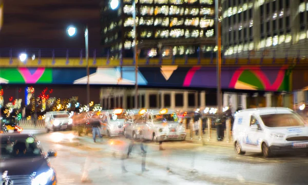 Night city of London view in blur. City street blurry photo, bokeh image. UK London