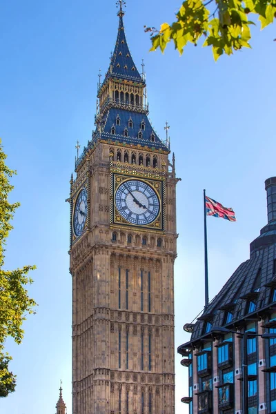 The Union Flag flying in front of the clock tower Big Ben, Palace of Westminster. London UK