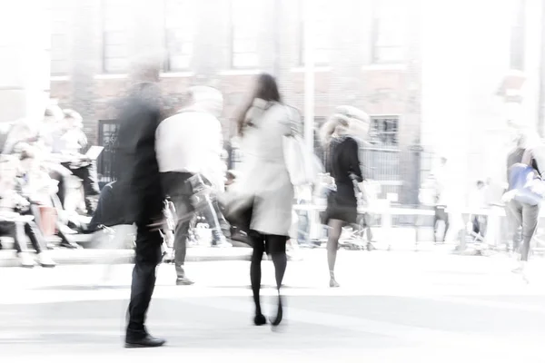 Business people blur. People walking in the City of London, business and financial aria