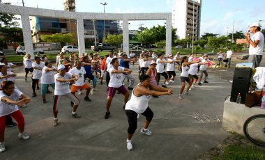 people doing physical exercise on the street