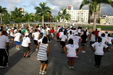 people doing physical exercise on the street