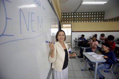 teacher preparing for enem's test