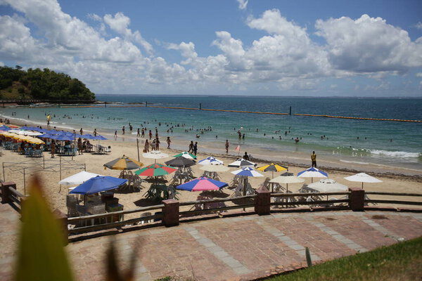 salvador, bahia / brazil - january 31, 2018: People are seen on the Nossa Senhora de Gaudalupe beach on Frades Island in th city of Salvador. *** Local Caption *** .