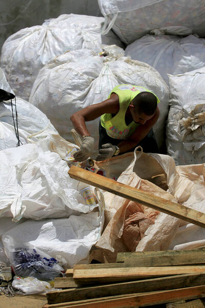 salvador, bahia / brazil - March 2, 2014: man is seen collecting material for recycling during carnival in the city of Salvador
