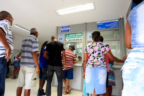 salvador, bahia / brazil - december 20, 2016: people are seen in a lottery queue in the Cajazeiras neighborhood in the city of Salvador