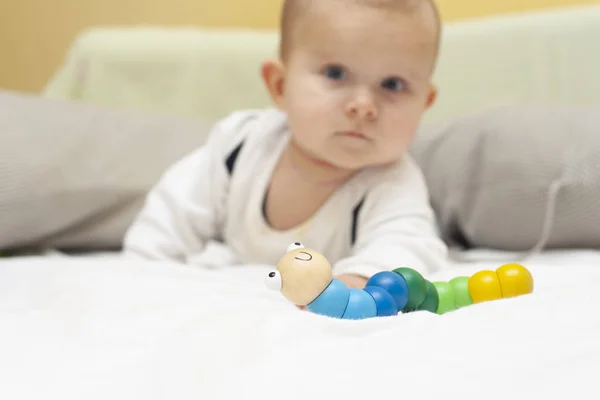 Infant Baby Playing Toy Caterpillar — Stock Photo, Image