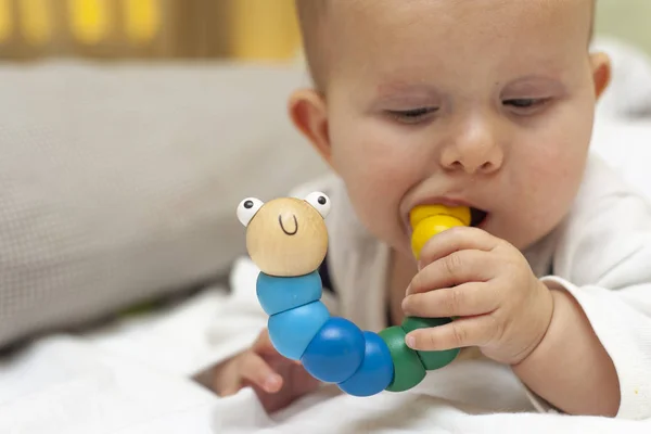 Infant Baby Bites Toy Caterpillar — Stock Photo, Image