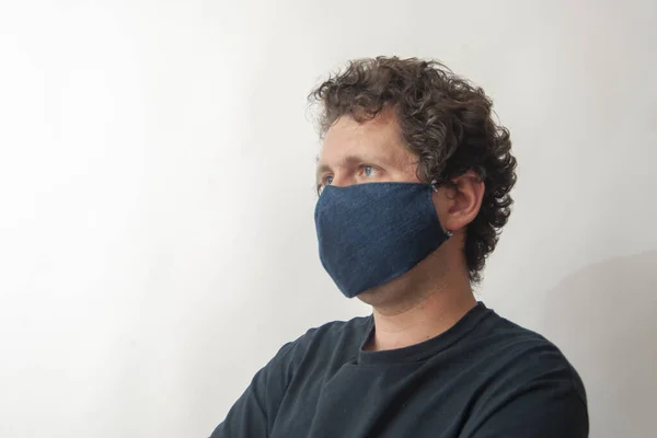 The young man in jeans medical mask.