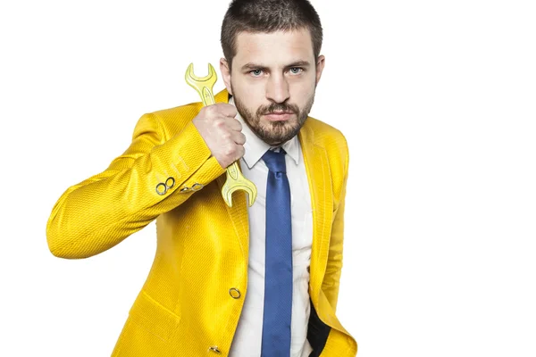 Portrait of a businessman with yellow key — Stock fotografie