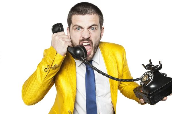 Businessman in a gold suit negotiates by phone — ストック写真