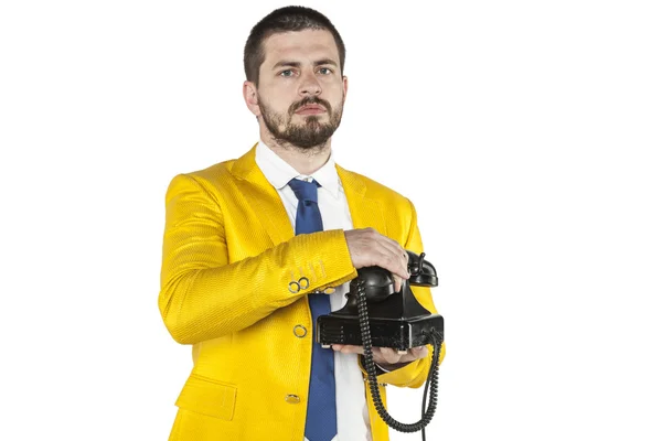 Businessman in a gold suit hangs up the phone — Stock fotografie