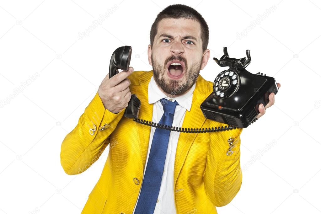 angry businessman screaming to the phone, funny facial expressio