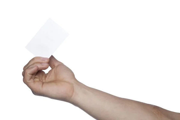 Mano masculina sobre un fondo blanco sosteniendo una tarjeta, espacio para copiar — Foto de Stock