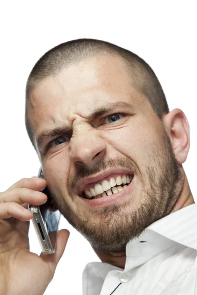 Angry businessman talking by telephone — Stock Photo, Image