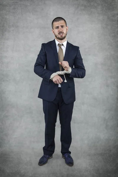 Businessman with bound hands — Stock Photo, Image