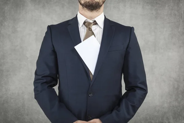 Bribe sticking out from under a suit — Stock Photo, Image