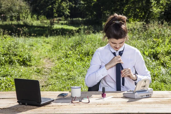 business woman struggling with a tie