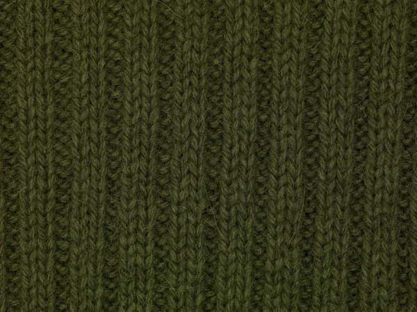Groene stof trui close-up textuur achtergrond — Stockfoto