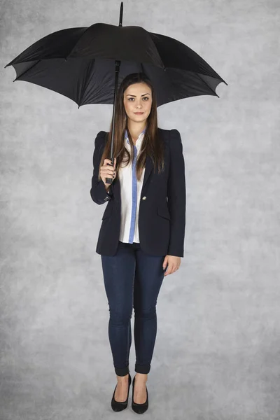 Business woman under an umbrella, worker protection — Stock Photo, Image