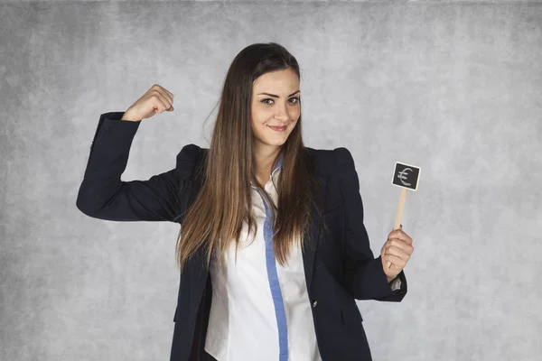 Mujer de negocios mostrando la moneda del euro es fuerte —  Fotos de Stock