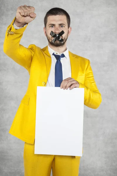 Businessman holding a blank card, calls for revolution — Stock Photo, Image