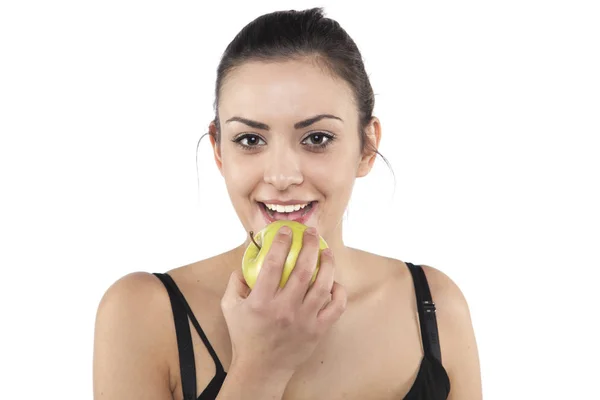Beautiful girl eats an apple — Stock Photo, Image