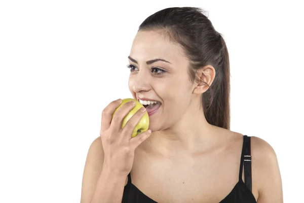 Young beautiful girl eats an apple — Stock Photo, Image
