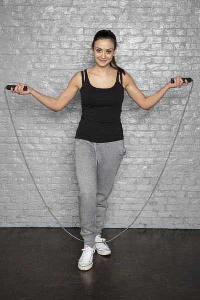 Happy woman with skip roap — Stock Photo, Image