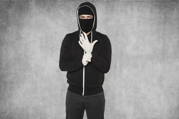 Masked man wearing gloves — Stock Photo, Image
