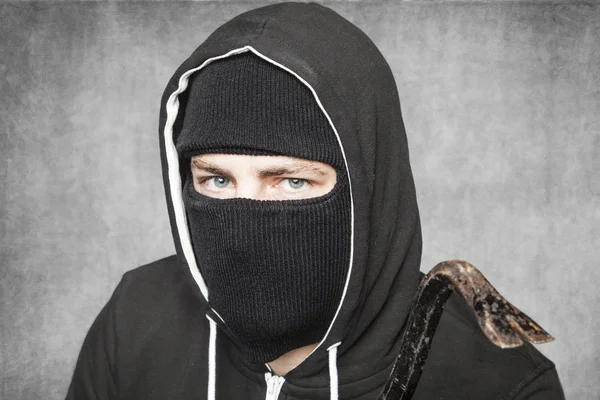 Thief with a crowbar in his hand, close up — Stock Photo, Image
