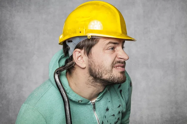 The worker puts up an ear to eavesdrop on others