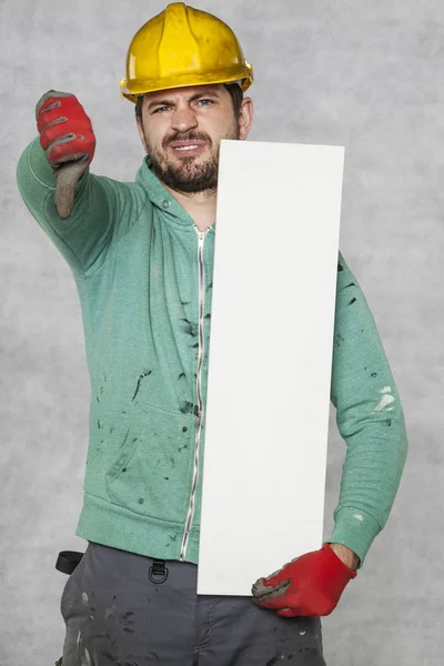 Happy worker shows ad, thumb down — Stock Photo, Image